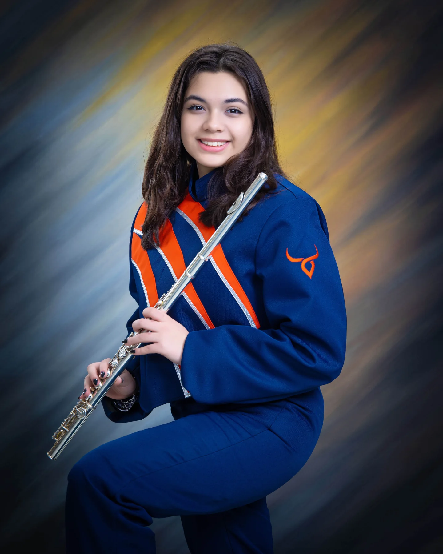 Band portrait in a blue uniform holding a flute
