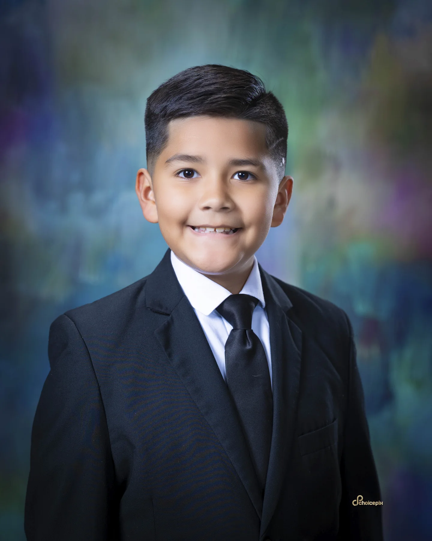 Elementary portrait in a dark suit and tie