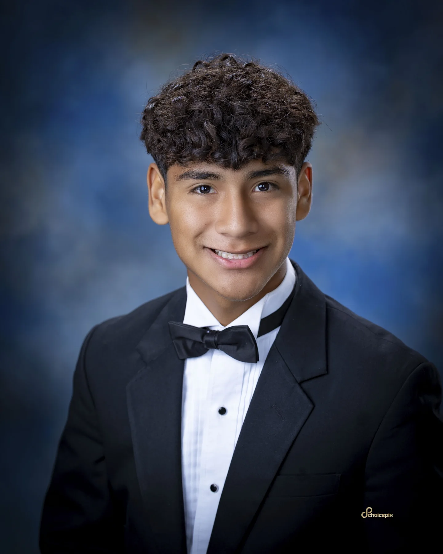 Senior portrait in a black tuxedo and bow tie